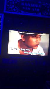 a television screen with a picture of a black woman at Vân Anh Guesthouse in Yên Bái