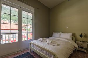 Ένα ή περισσότερα κρεβάτια σε δωμάτιο στο Ev Zin Lemonia