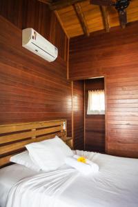 Uma cama ou camas num quarto em Pousada Cabanas Kaia Lua