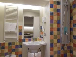 a bathroom with a sink and a shower at Hotel Villa Lalla in Rimini +41 photos