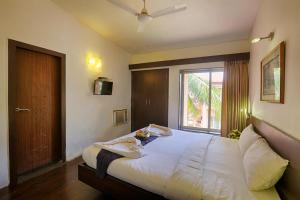 Letto o letti in una camera di The Byke Old Anchor Beach Resort & Spa