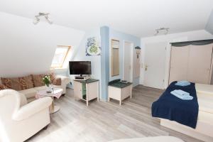 TV a/nebo společenská místnost v ubytování Hotel Garni Am Deich