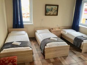 Posteľ alebo postele v izbe v ubytovaní Pokoje Goscinne ATENA