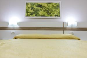 Postel nebo postele na pokoji v ubytování Hotel Trevita Foz