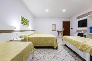 Postel nebo postele na pokoji v ubytování Hotel Trevita Foz
