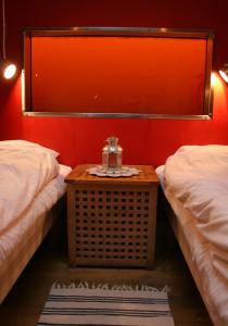 
a bedroom with a bed and a lamp at Utter Inn in Västerås
