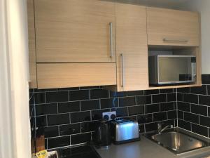 Kuchyň nebo kuchyňský kout v ubytování W6 Hotel