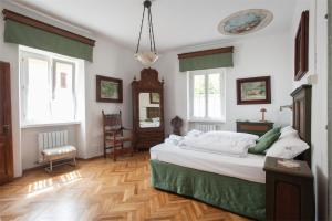 Postel nebo postele na pokoji v ubytování Dimora Storica Caproni