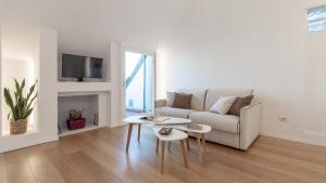 Televízia a/alebo spoločenská miestnosť v ubytovaní Stunning View Apartment