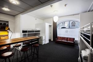 a room with a bar and some stools at City Backpackers Hostel in Stockholm