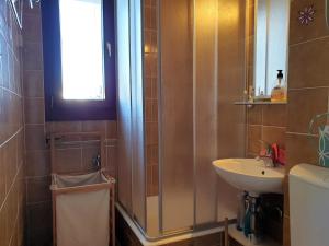 a bathroom with a sink and a shower at Apartment IVANA in Novalja