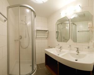 a bathroom with a sink and a shower at Appartements Fliana Mathon/Ischgl in Ischgl +18 photos