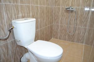 a bathroom with a toilet and a shower at GITE D'etape SIDI FLAH in Sidi Flah