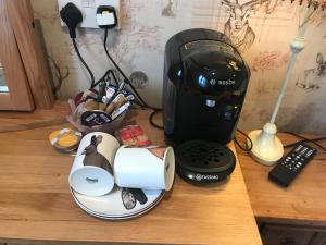 a black blender sitting on top of a wooden counter at Rokeby Inn in Newsham