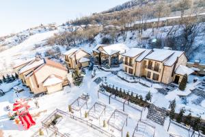 an aerial view of a resort in the snow at Elegant Hotel & Resort in Tsaghkadzor