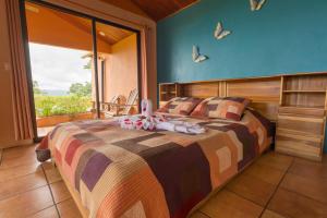 Ein Bett oder Betten in einem Zimmer der Unterkunft Hotel Nepenthe B&B
