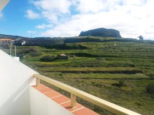 a view of a field from the balcony of a house at Hotel Sonia Chipude in El Cercado