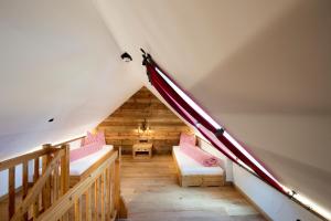 Letto o letti in una camera di Ludlalm am Prebersee