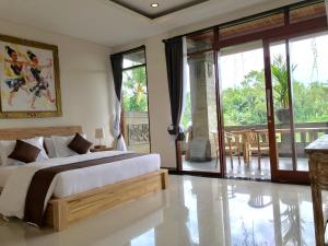 Postel nebo postele na pokoji v ubytování Ubud Paras Villa + 37 fotografií
