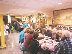 a group of people sitting at tables in a restaurant at Hotel Sonia Chipude in El Cercado +22 photos