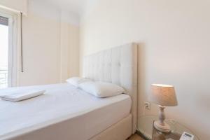 Postel nebo postele na pokoji v ubytování Super Paradise Apartments