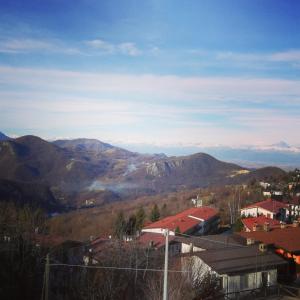 a view of the mountains from a city at Albergo Nazionale in San Giacomo