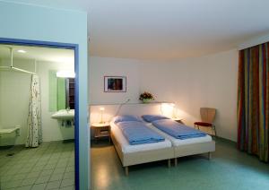 Rúm í herbergi á Hotel Kolping Wien Zentral