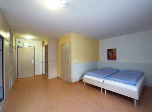 Rúm í herbergi á Hotel Kolping Wien Zentral