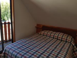 Postel nebo postele na pokoji v ubytování Casona Familiar Pucon Centro