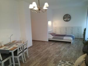 a bedroom with a bed and a table and chairs at Budapest Center Apartment in Budapest