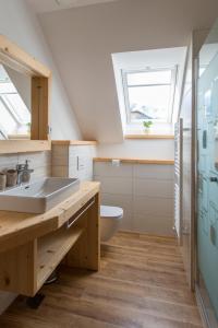 Koupelna v ubytování Apartmaji Štrud´l Bohinj