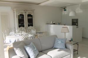 a living room with a couch and a table at La Reale in Villefranche-sur-Mer