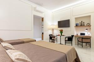 A kitchen or kitchenette at Cavour Suites Guest House