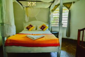 Katil atau katil-katil dalam bilik di Upani in Diani