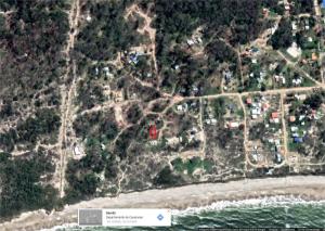 a map of a neighborhood with a red house at La casa de Juan in Cuchilla Alta