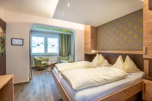 Posteľ alebo postele v izbe v ubytovaní Bliem's Familienhotel