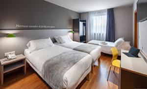 Cama o camas de una habitación en ibis Styles Pamplona Noain