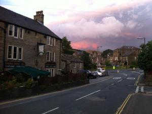 an empty street in a town with at Kinder Lodge in Hayfield