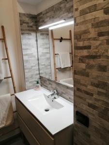 a bathroom with a sink and a mirror at Ca' antica in Rovereto