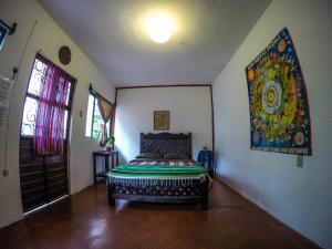 Una cama o camas en una habitación de Hostel El Nagual
