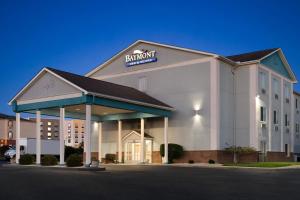 a hotel front of a building with a sign on it at Baymont by Wyndham Elizabethtown in Elizabethtown