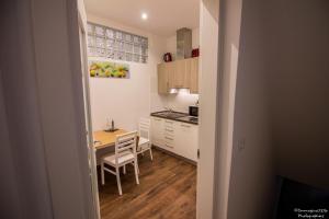 a small kitchen with a table and a dining room at Silver Suite in Venice