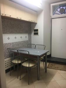a dining room table and chairs in a room at La casetta di Monterosso in Monterosso al Mare +5 photos