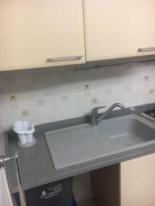 a kitchen counter with a sink and a toilet at La casetta di Monterosso in Monterosso al Mare