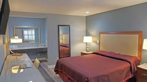 Ένα ή περισσότερα κρεβάτια σε δωμάτιο στο Del Mar Motel
