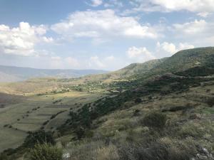 a view of a valley with mountains in the background at Oasis in Aspindza