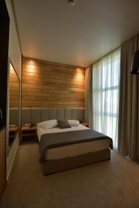 Een bed of bedden in een kamer bij Hotel ABC