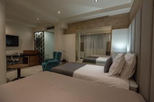Een bed of bedden in een kamer bij Hotel ABC