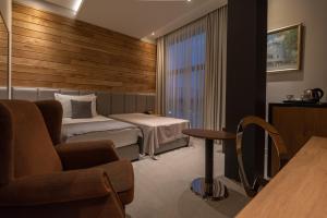 Een bed of bedden in een kamer bij Hotel ABC