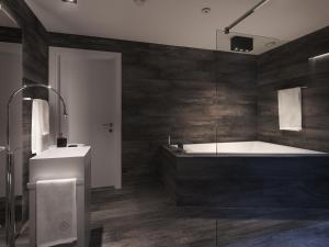 La salle de bains est pourvue d'une baignoire et d'un lavabo. dans l'établissement Le Bijou Lintheschergasse / Zurich HB, à Zurich
